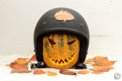 Halloween carved pumpkin in helmet