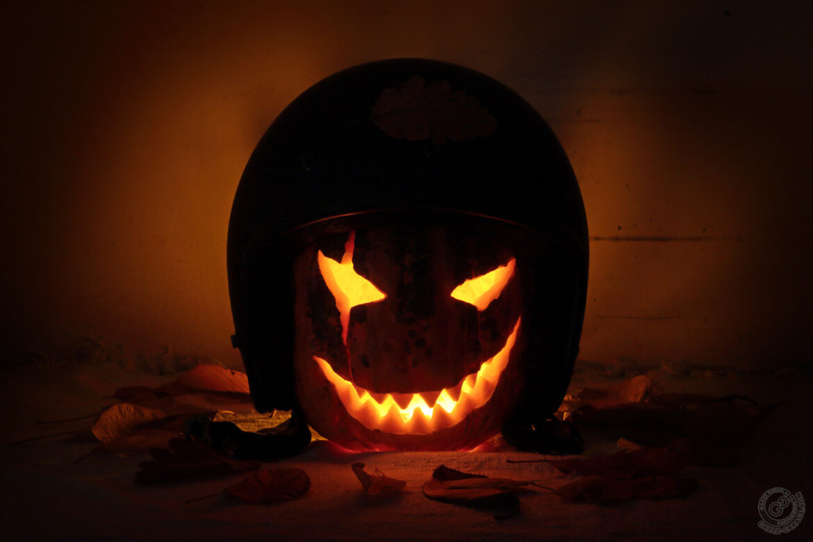 Halloween carved pumpkin in helmet
